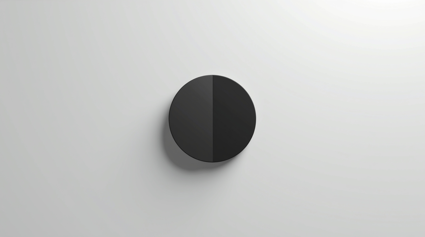 Minimalist black split circle on a light grey background symbolizing builders versus performers