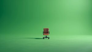 Empty toy office chair on a neon green background symbolizing silent job loss.